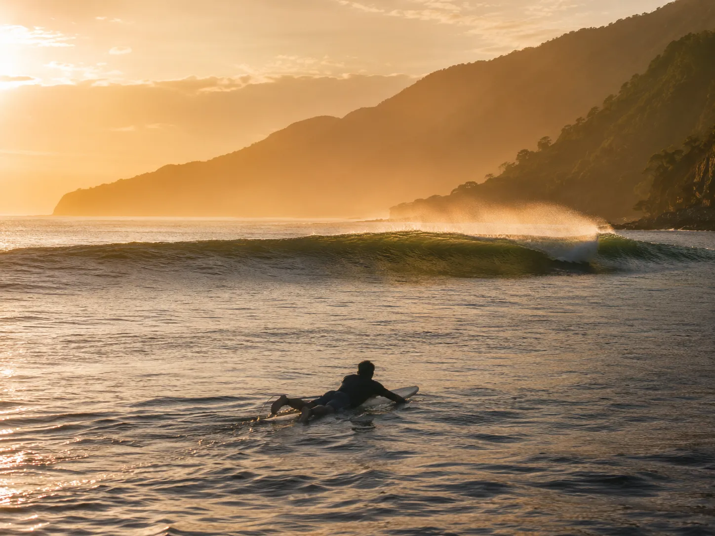 Fisherman pulling in nets on a quiet Timor beach